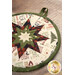 A super close up image of the edge of the round folded star hot pad demonstrating fabric details. 