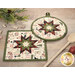 A closer look at the two Folded Star Hot Pads, demonstrating fabric color and print details.