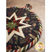 A super close up image of the edge of the round folded star hot pad demonstrating fabric details. 
