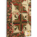 A closer look at the lower left corner of the quilt, demonstrating fabric and patchwork details.