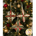 The three completed Cathedral Window Ornaments, colored in cream, green, and red fabrics from the Merry Manor Metallic 2025 collection, hung on a decorated Christmas Tree.