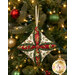 A closer look at the fabrics of the ornament, showing print colors and details.