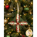 A closer look at the fabrics of the ornament, showing print colors and details.