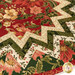 A close up on the topper, showing details on the metallic fabric prints.