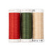 Three spools of red, green, and cream thread, isolated on a white background. 