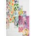 A close up on the quilt showing details on the fabric colors, prints, and top quilting details.