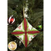 A closer look at the bright green, red, and cream fabrics of the ornament, showing print colors and details.