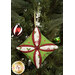 A closer look at the bright green, red, and cream fabrics of the ornament, showing print colors and details.