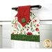 An angled close up on the top of the towel, demonstrating fabric colors on the prints and fabric button.