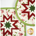 A closer look at the two Folded Star Hot Pads, demonstrating fabric color and print details.