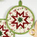A closer look at the round Hot Pad, demonstrating fabric color and print details.