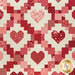 A closer look at the patchwork of the quilt, showing details on the layout.