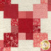 A super close up on the patchwork chain blocks, demonstrating fabric and top quilting details.