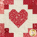 A super close up on the patchwork heart blocks, demonstrating fabric and top quilting details.