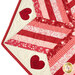 A super close up on one corner of the topper, demonstrating fabric color and print details.