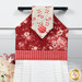 A super close up on the top of the towel, demonstrating fabric colors on the prints and fabric button.