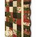 A closer look at the patchwork of the quilt, showing print colors and details.