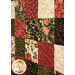 A closer look at the patchwork of the quilt, showing print colors and details on the gold metallic accented fabrics.