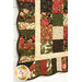 A closer look at the patchwork of the quilt, showing print colors and details.