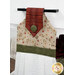 An angled close up on the top of the towel, demonstrating fabric colors on the prints and fabric button.