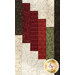 A super close up on the patchwork of the quilt, demonstrating fabric colors and print details.