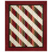 The completed 28th Floor Quilt colored in cream, red, pink, and green fabrics from the Hearth & Home collection by Henry Glass Fabrics, isolated on a white background. 