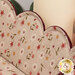A super close up on the inside of the basket, demonstrating details on the inner floral print.