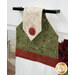 An angled close up on the top of the towel, demonstrating fabric colors on the prints and fabric button.