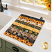 The completed Dry Ideas project, colored in black, yellow, cream, and green fabrics from the Sunflower Serenade collection by QT Fabrics, staged on a white marble kitchen counter with coordinating decor.