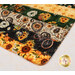 A super close up on the mat demonstrating fabric prints and color details.