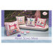 The front of the cross stitch pattern, showcasing the finished project alongside the pattern name. 