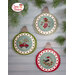 The completed projects, staged on a wooden background and surrounded by coordinating festive greenery.