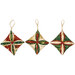 The three completed Cathedral Window Ornaments, colored in cream, green, and red fabrics from the Poinsettias at Christmas collection by Jennifer Bosworth for Riley Blake Designs, isolated on a white background. 