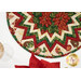 A top down shot of the topper, demonstrating fabric color and print details on the folded points as well as the binding.