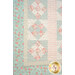A closer look at the patchwork of the quilt, demonstrating patchwork layout and fabric details.
