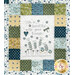 A close up on the quilt, showing details on a panel block that says "Life is beautiful with good friends."