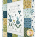 A close up on the quilt, showing details on a panel block that says "Share good times with a friend."