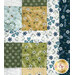 A close up on the patchwork of the quilt, demonstrating fabric color and print details.