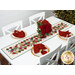 A lifestyle image of the completed bonus runner, staged on a white table with four coordinating place settings beside poinsettias and a lit tree.