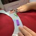 The SewTites mini magnetic in use with non-pinable fabric and a sewing machine. 