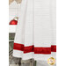 A super close up on the bottom of the towel, showing details on the towel texture and the fabric stripe.