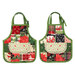 The two apron hot pads  colored in fabrics from the Holiday Cheer collection by Moda Fabrics, isolated on a white background. 