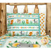 The completed Safari Snuggles Magic Pillowcase, colored in aqua, orange, white, and green fabrics, staged on a log bed with the coordinating quilt project.