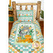 A shot of the Safari Snuggles pillowcase staged on a log bed with the coordinating quilt.