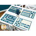 The four completed Fat Quarter Shuffle Mats, colored in cream and blue fabrics from the Special Delivery collection by Andover Fabrics, set on a white table with coordinating flowers.