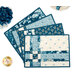 The four completed Fat Quarter Shuffle Mats, fanned out on a white table.
