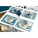 The four completed Fat Quarter Shuffle Mats, colored in cream and blue fabrics from the Special Delivery collection by Andover Fabrics, set on a white table and staged with four coordinating table settings and flowers.
