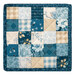 The completed Fusible Grid Hot Pad colored in cream and blue fabrics from the Special Delivery collection by Andover Fabrics, isolated on a white background. 