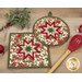 A closer look at the two Folded Star Hot Pads, demonstrating fabric color and print details.