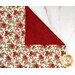 A top down shot of the napkin, folded so as to demonstrate the two reversible prints.
